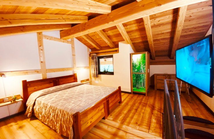 Grand coin nuit en mezzanine avec lit double - Suite Village Paradis